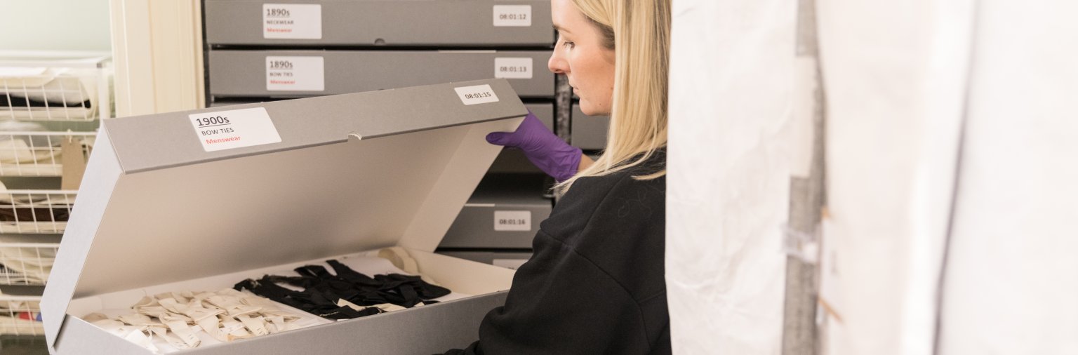 Image: A Fashion Museum curator in the storeroom