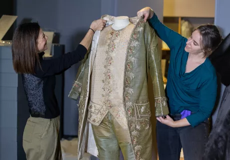 Image: Curators removing items from the displays